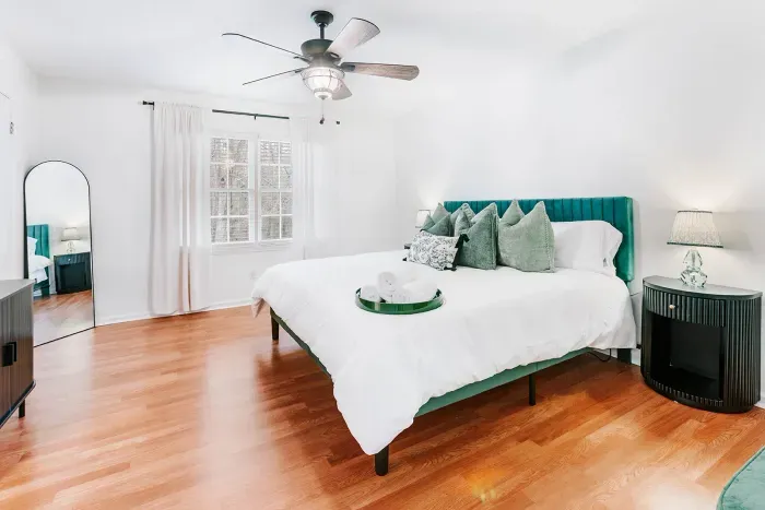 Bright, airy bedroom designed for comfort, restful sleep, and relaxed mornings.