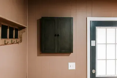 Classic dart board setup tucked neatly away for a clean look and easy access when it’s game time.