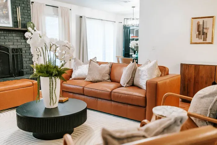 Plush leather seating paired with soft textures for a cozy, effortlessly inviting feel.