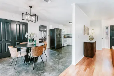 Open, connected dining and kitchen space designed for easy flow and gathering.