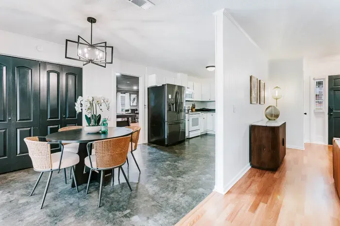 Open, connected dining and kitchen space designed for easy flow and gathering.