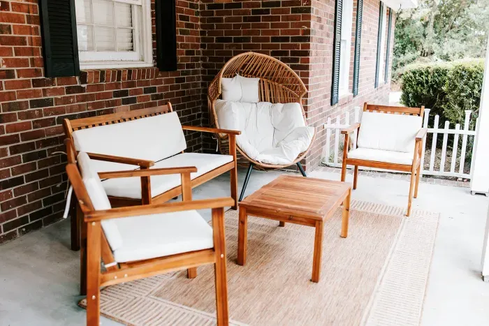 Inviting front porch seating perfect for morning coffee or evening chats.