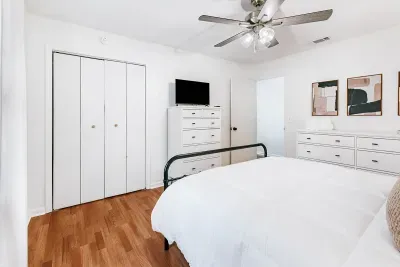 Bright bedroom with ample storage, modern touches, and a peaceful atmosphere.