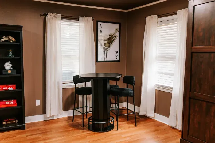 Casual high-top seating perfect for drinks, cards, or watching the action nearby.