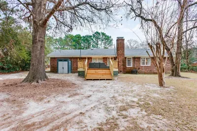 Private backyard setting with deck access and peaceful surroundings.