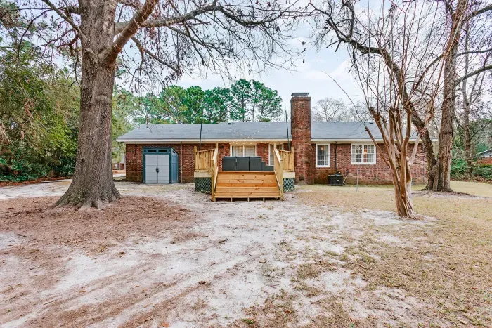 Private backyard setting with deck access and peaceful surroundings.