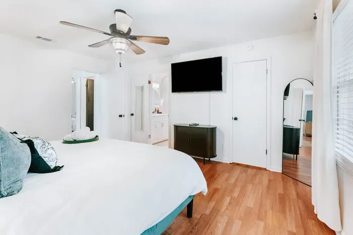 Spacious bedroom with modern comforts, clean lines, and room to truly unwind.