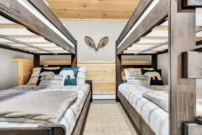 Welcome to bedroom number 3, a haven of comfort and versatility. Featuring a twin bed over a full bed and another twin bunk bed, this space is perfect for sleepovers and endless adventures, offering plenty of room for everyone to relax and enjoy.
