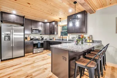 This kitchen is a creative hub with ample counter space and storage, perfect for preparing meals with local ingredients. Whether enjoying a quiet meal or hosting a feast, it brings home-like warmth and comfort, enhancing your travel dining experience