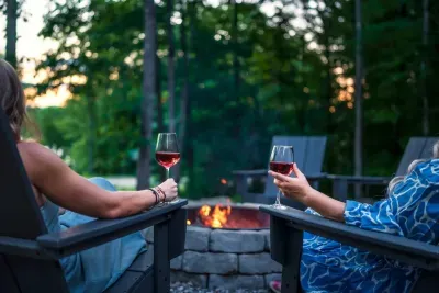 A picturesque sunset by the fire.  Grab your favorite cocktail and toast to all of the wonderful memories that you've made at Twin Lakes Chalet.