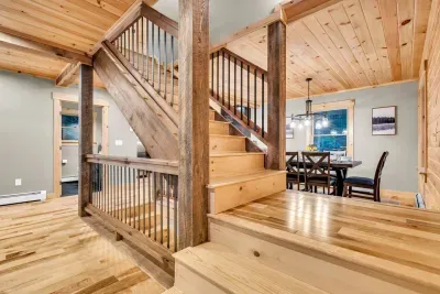 Our central staircase, a true architectural masterpiece, elegantly links the main living area with the two master suites upstairs, showcasing seamless design and sophistication.