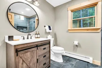 Adjoining the first master bedroom, enjoy the luxury of a full ensuite bathroom, featuring a revitalizing shower designed for your comfort and rejuvenation.