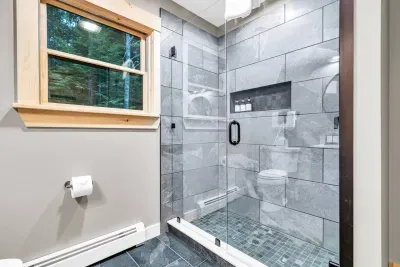 Indulge in the spacious luxury of our ensuite bathroom, where a revitalizing shower awaits to provide a rejuvenating experience. Enjoy the convenience of complimentary shampoo, conditioner, and body wash, ensuring unmatched comfort and relaxation.