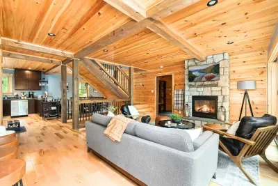 The crackling fireplace becomes the heart of warmth and comfort. The gentle flicker of the flames casts a soothing glow. Whether you're settling down with a favorite novel or enjoying a movie night, this haven of relaxation promises a serene escape.