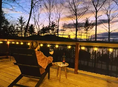 Set on a charming deck, Adirondack chairs offer a serene escape with seasonal lake and mountain views. Enjoy vibrant seasonal hues, breathtaking sunrises, and peaceful sunsets in this tranquil retreat.