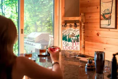 The sleek wet bar, perfectly positioned between the living room and just steps from the deck, is the perfect place to craft your favorite cocktail.  Happy Hour begins now.  Cheers!