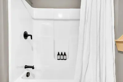 Introducing our downstairs full bathroom, complete with a relaxing bathtub for your comfort and convenience.