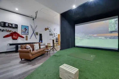 The game room area offers tons of space for family and friends to spread out and relax. From hitting golf balls on the golf simulator to playing shuffle board, there is something for everyone in the group to have fun.
