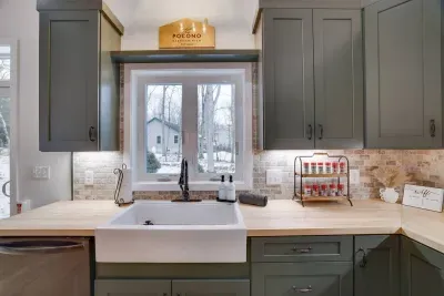 Watch deer wander by while prepping meals at our farmhouse sink! Our custom kitchen at the Pocono Barndominium comes stocked with everything you need for group cooking in the mountains.