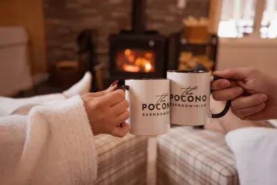Cheers to slowing down. Warm up with your morning brew while watching wildlife through the windows at our luxury group rental in the Poconos, just minutes from Jim Thorpe.