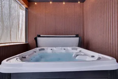 Soak in style in our 7-person covered hot tub—your perfect Poconos retreat after a day of adventure.