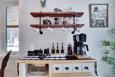 Coffee lovers rejoice. Our custom coffee bar features a Ninja DualBrew, frother, syrups, K-cups, and teas for the perfect morning brew at the Pocono Barndominium near Jim Thorpe.