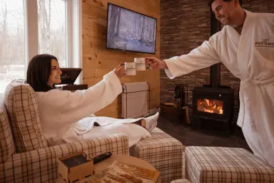 Morning coffee by the fire hits differently here. Slip into your complimentary robes and soak in the cozy vibes at our luxury Poconos retreat near Jim Thorpe and Lake Harmony.