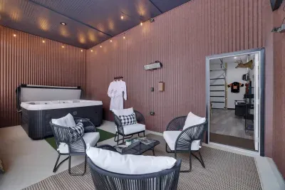 Lounge in comfort on our stylish outdoor patio furniture, perfectly positioned beside the 7-person covered hot tub. Whether you're soaking or sipping, enjoy the cozy heat lamp glow, mounted TV, and custom robes for the ultimate Poconos hangout.