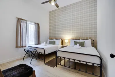 The Birch Room blends modern farmhouse style with cozy comfort at the Pocono Barndominium. Two full beds sleep 4 guests in this luxury group rental near Jim Thorpe, perfect for bachelorette weekends and celebrations.