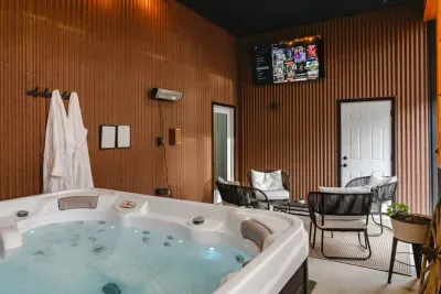 Unwind in our covered hot tub oasis, complete with a mounted TV, cozy heat lamp ambiance, and custom robes for the ultimate après-adventure relaxation in the Poconos.