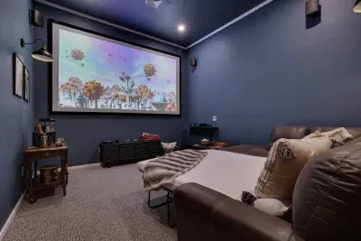 Need extra sleeping space? Our theater room converts to a cozy bedroom with a pull-out full bed at the Pocono Barndominium. This flexible luxury rental near Jim Thorpe sleeps 14 total, perfect for large group celebrations in the Poconos.