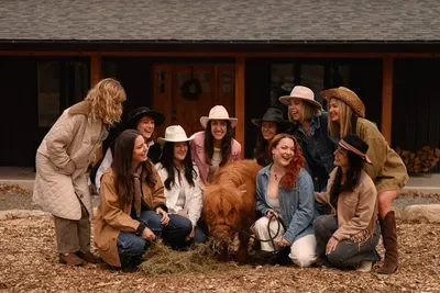 Highland cow cuddling sessions and photo shoots available as a concierge service at The Pocono Barndominium. Perfect activity for bachelorette parties, brithdays and family reunions. The only Airbnb in the Poconos offering this experience!