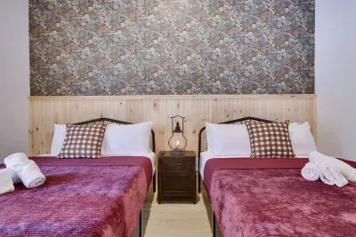 Thoughtful design meets comfort in our Maple Room. Inspired by nature with custom wallpaper and cozy bedding, this ADA accessible Pocono vacation rental near Lake Harmony offers hotel-quality stays for celebrations.