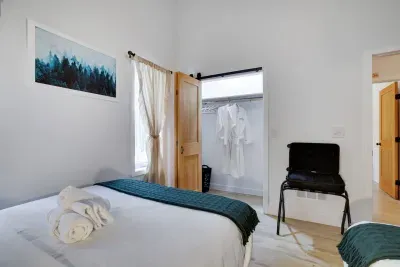 Robes included for ultimate relaxation. The Pine Room offers a spacious closet and plush Pocono Barndominium robes at our pet-friendly, ADA accessible luxury rental minutes from Jim Thorpe adventures.