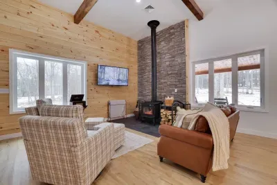 Gather around the wood-burning stove in our bright, open living room with vaulted ceilings. The perfect spot to unwind after exploring Jim Thorpe and the Poconos.