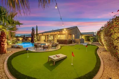 Mini golf, putt putt, cornhole, or other fun activities can happen in this great and spacious backyard.