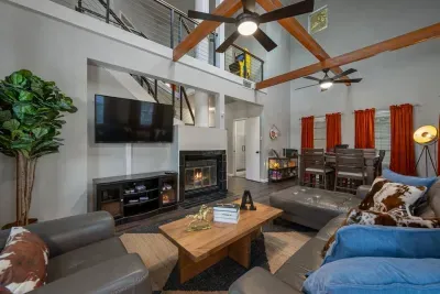 Living room has plenty of seating, including a high top table with lots of games!