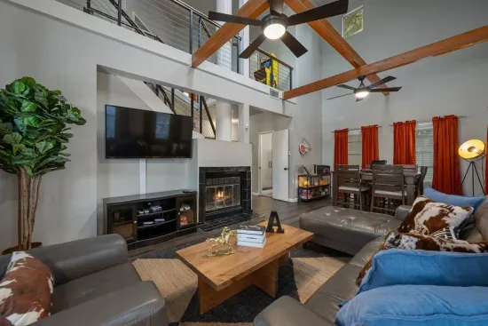 Living room has plenty of seating, including a high top table with lots of games!