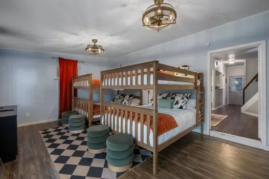 Two queen over queen bunk beds in the downstairs bedroom.