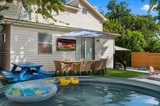 Watch the big game, a movie or put on music videos while lounging in the pool and grilling!