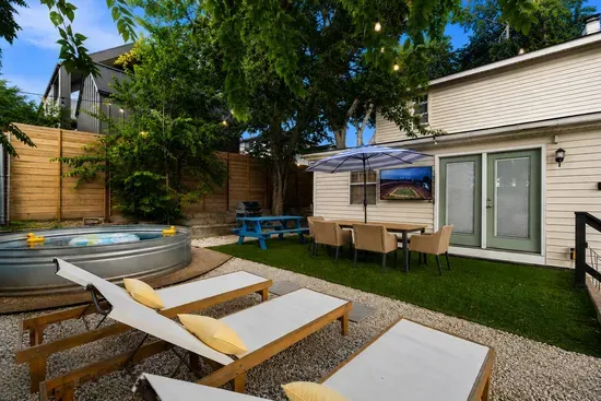Great view of the outdoor TV from lounge chairs, cowboy pool, or outdoor tables!