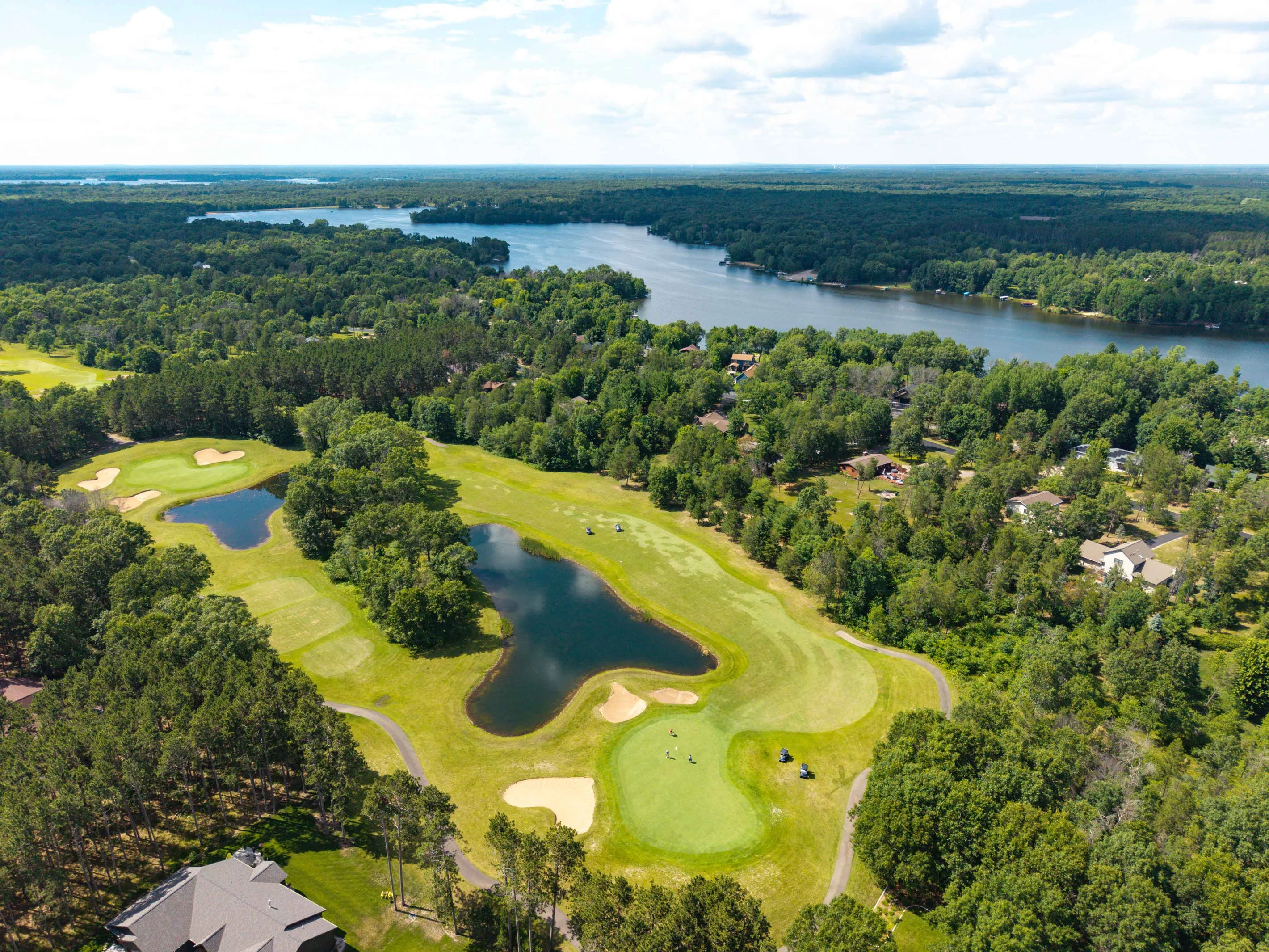Aerial view of golf course fairway with sand bunkers and trees near Nekoosa Wisconsin