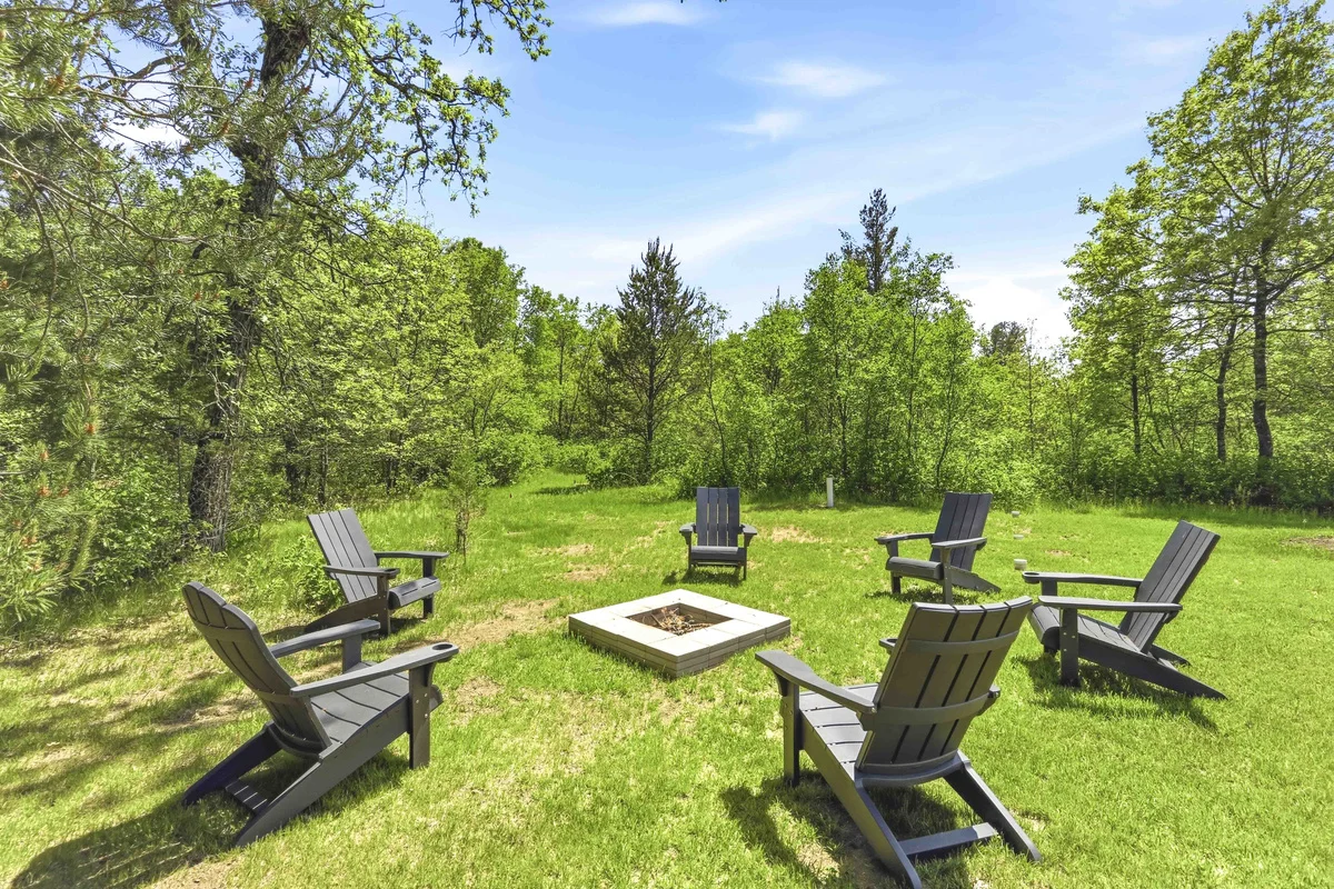 Black Adirondack chairs around the fire pit at Hidden on the 17th Hole Nekoosa, WI