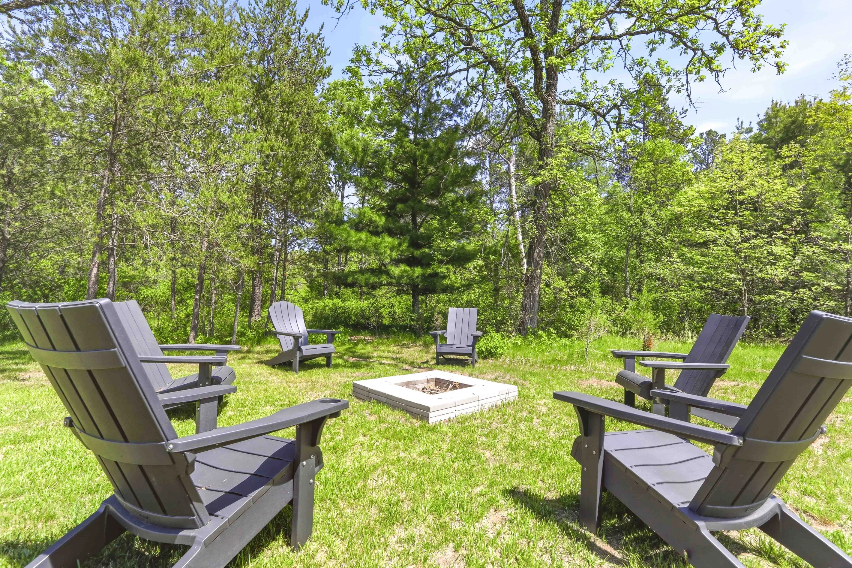 Small vacation rental fire pit setting compared to a hotel stay near Lake Petenwell