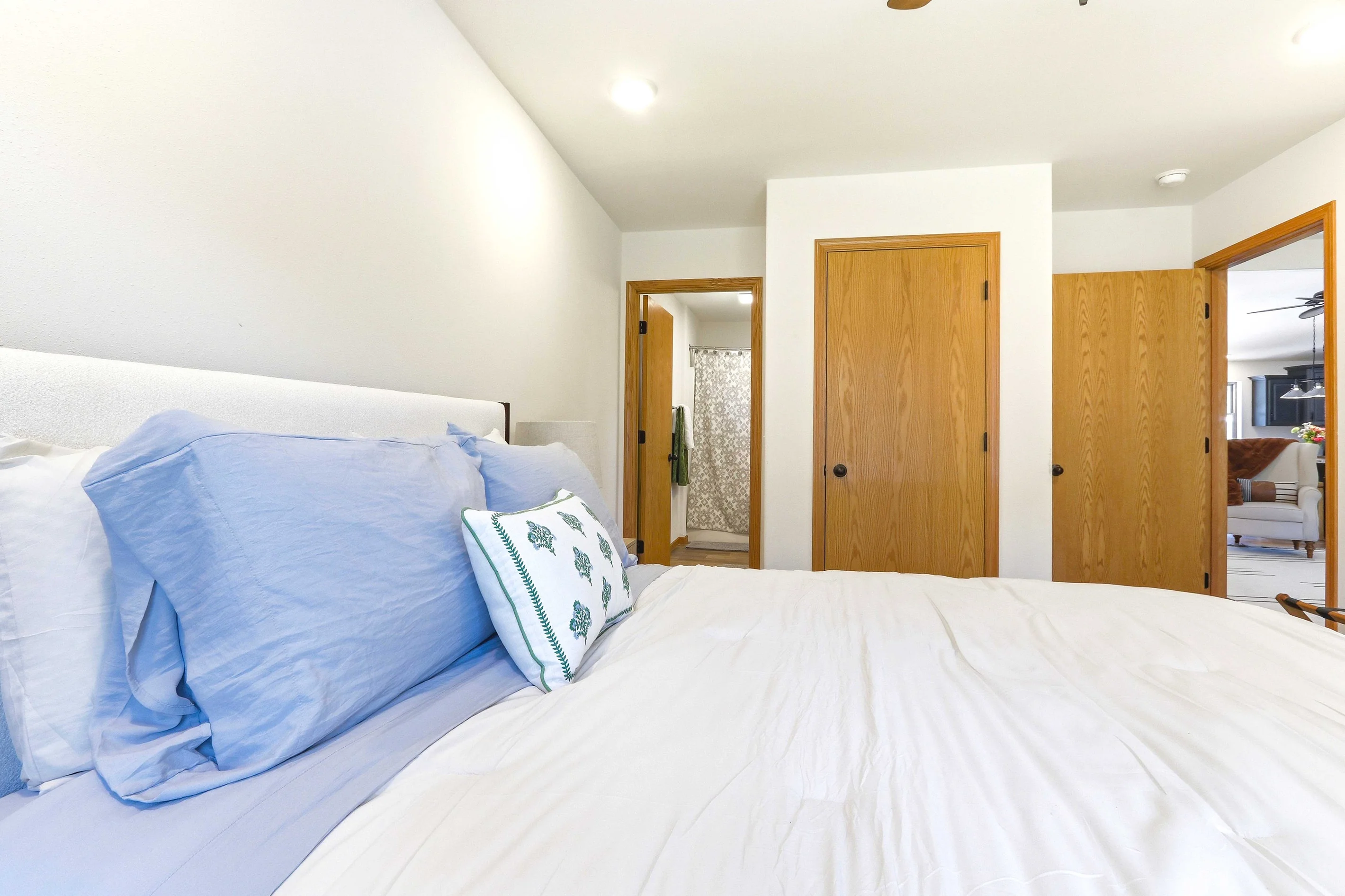 Modern bedroom with ensuite bathroom and wood cabinets in Nekoosa, WI cabin rental