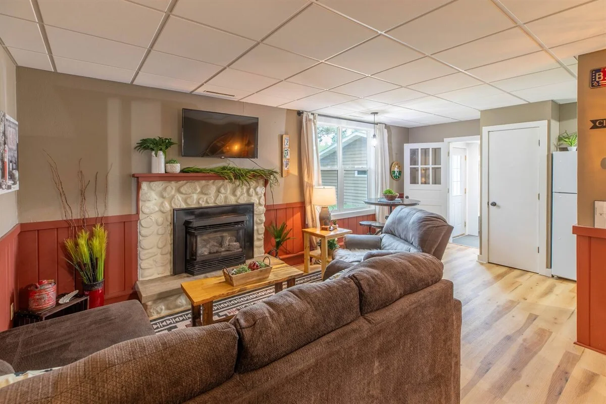 Cozy fireplace living room in a Minocqua WI cabin rental, ideal for where to stay in Minocqua WI