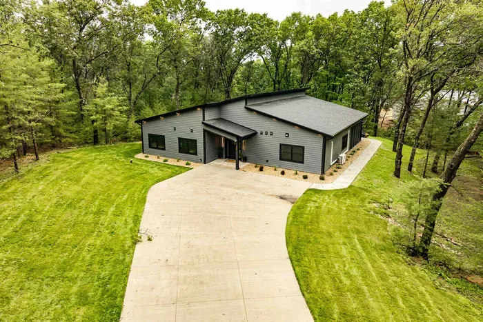 Tucked among the trees, this modern getaway offers a quiet setting and an easy, welcoming arrival.