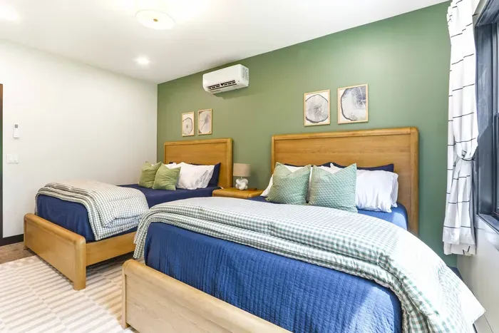 Settle into a calm, comfortable guest room designed for shared stays, slow mornings, and restful nights surrounded by nature.