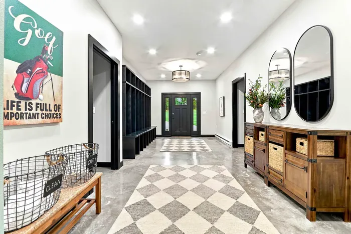 Settle in with a bright entryway featuring built-in cubby storage, towel baskets, and polished arrival-ready style.