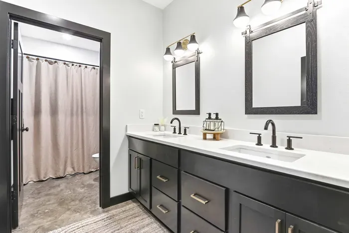 Refresh and reset with ease in a sleek dual-vanity bath designed for smooth mornings, shared stays, and polished comfort.